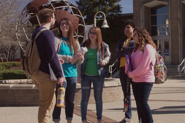 students walking out of SCC building