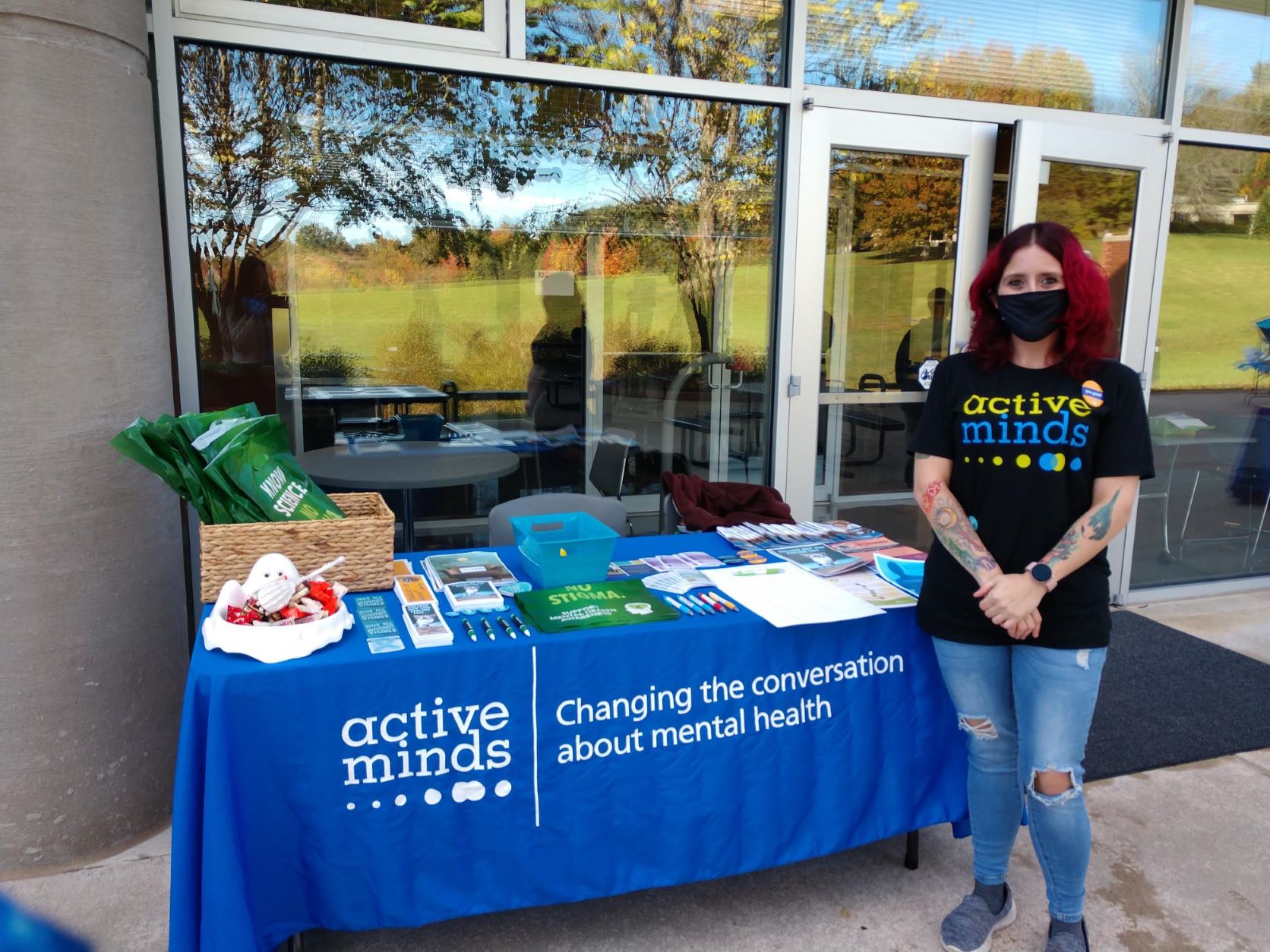 Active Minds student outside by the active mind table