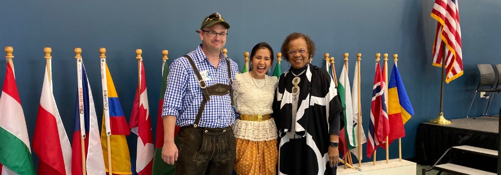 photo of Elaine Wilson, Chef Michael and student Tong Tong during International Festival event on campus