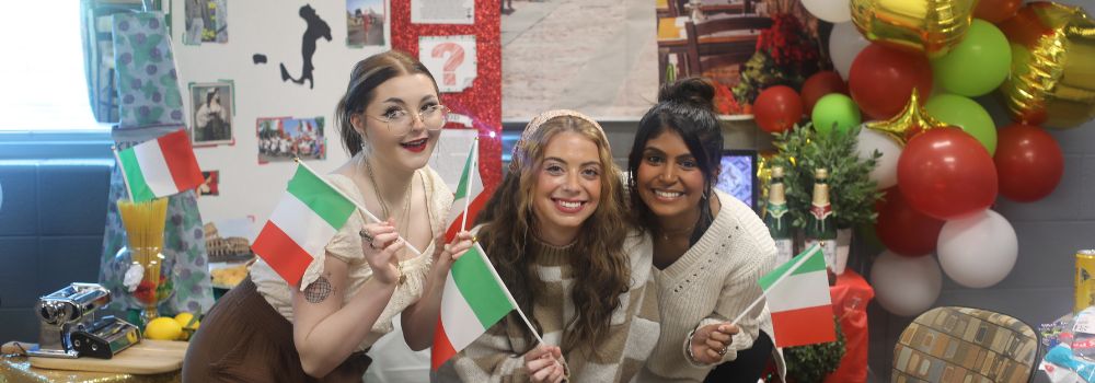 group of female students celebrating international festival table displays