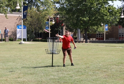 person on SCC's campus throwing a disc