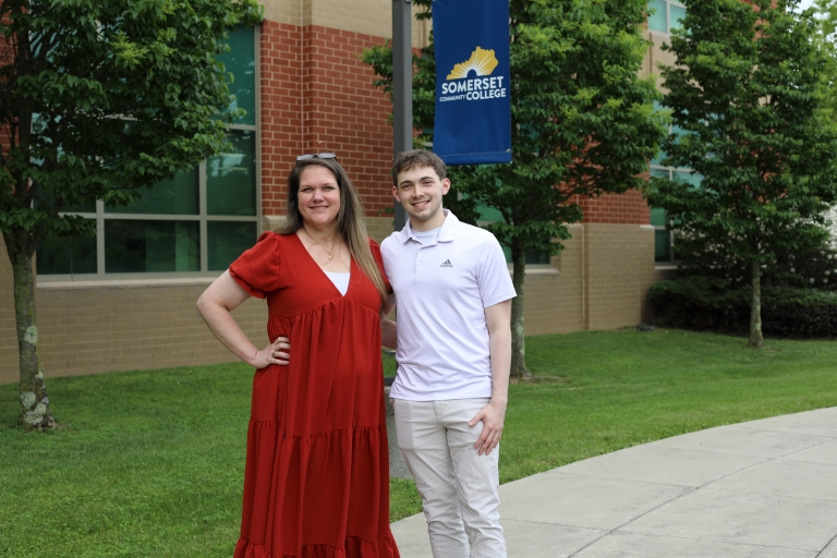 Student and mentor standing outside