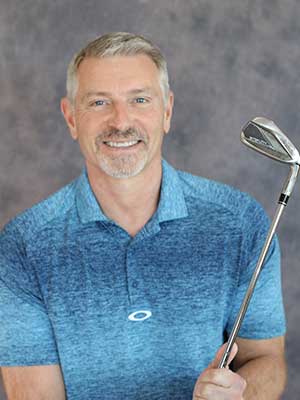 Sean Ayers holding a golf club