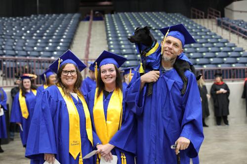 Ashley Paquin (Pulaski County Associate in Arts), Brittany Mills (Pulaski County Associate in Arts), and Justin Mahoney & dog Gideon (Associate in Arts focus Humanities - Pulaski County)