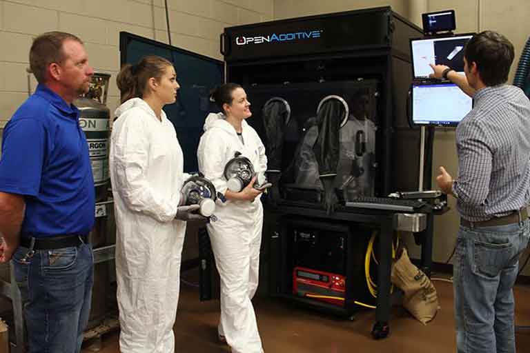 Mobile Additive Manufacturing Platform Team (Left to Right): Elaine Kohrman, Director of Grants, SCC; Dr. Ismail  Fidan, Professor of the Department of Manufacturing and Engineering Technology and College of Engineering- Faculty Fellow in Innovation and Techno-Entrepreneurship at Tennessee Technological University; Eric  Wooldridge, SCC professor and director of AMCOE.