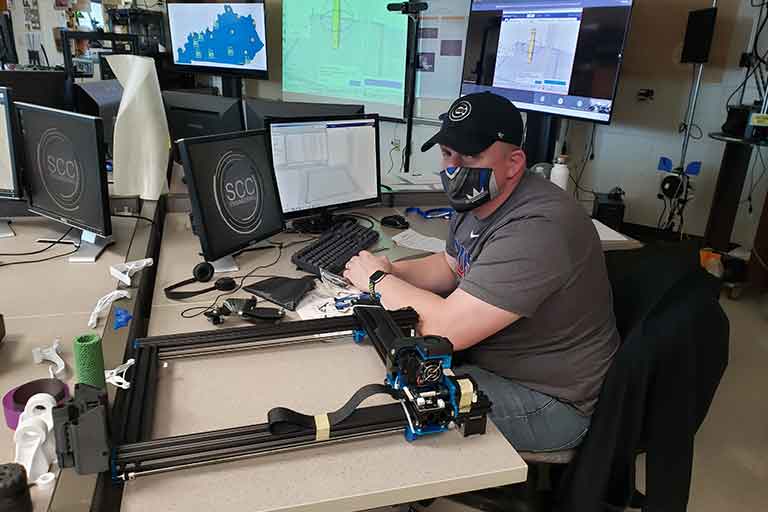 Paul Castaric of Seneca HS (KY) builds his 3D printer during a workshop