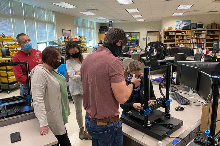 PI Wooldridge helping Mobile AMP workshop participants assemble 3D printers