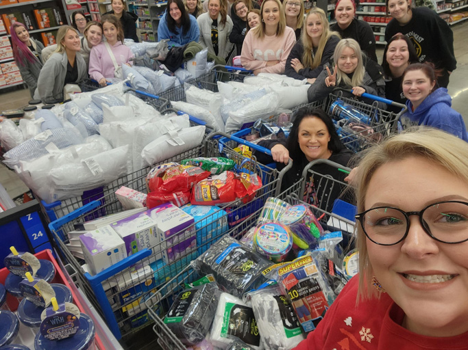 Somerset cosmetology students with the gifts for local rehab facilities