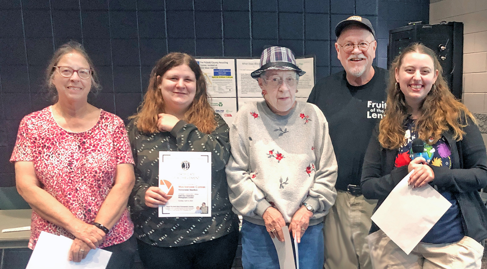 Peggy Yaeger of Corbin, left, took home first place honors and $100 in cash in Fruit of the Lens photography club’s Nash Black Photography Award competition. The Somerset Community College club recognized winners during its Earth Day Celebration on April 16. Also pictured are, from second left, honorable mention winner Mackenzee Conner of Somerset, award sponsor Irene Black, faculty advisor Stuart Simpson, and SCC student and club president Laurie Abbott.