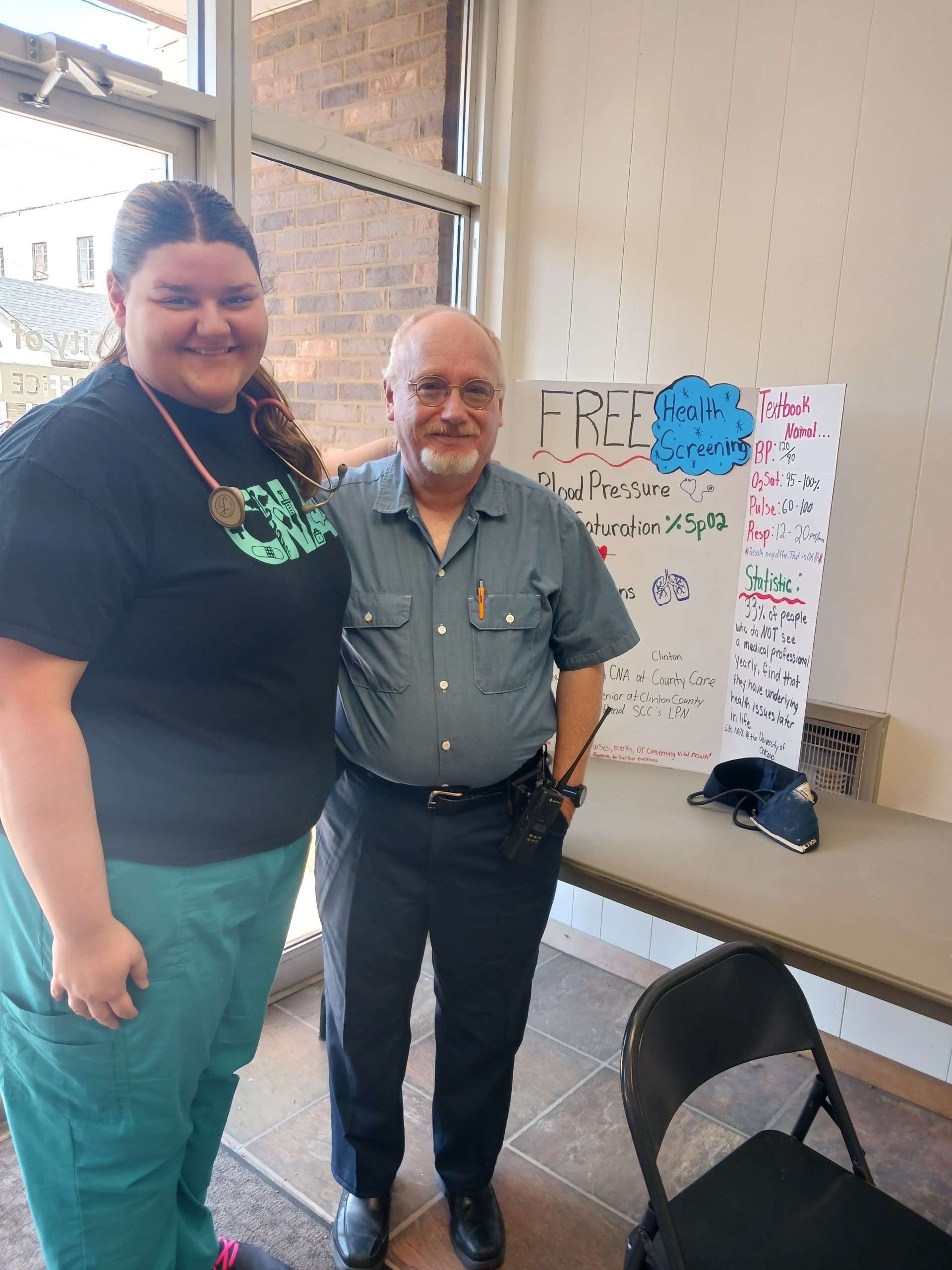 Student Alex Beasley serves the former mayor of Albany, Steve Lawson as part of her community project to provide free health screenings using her CNA skills