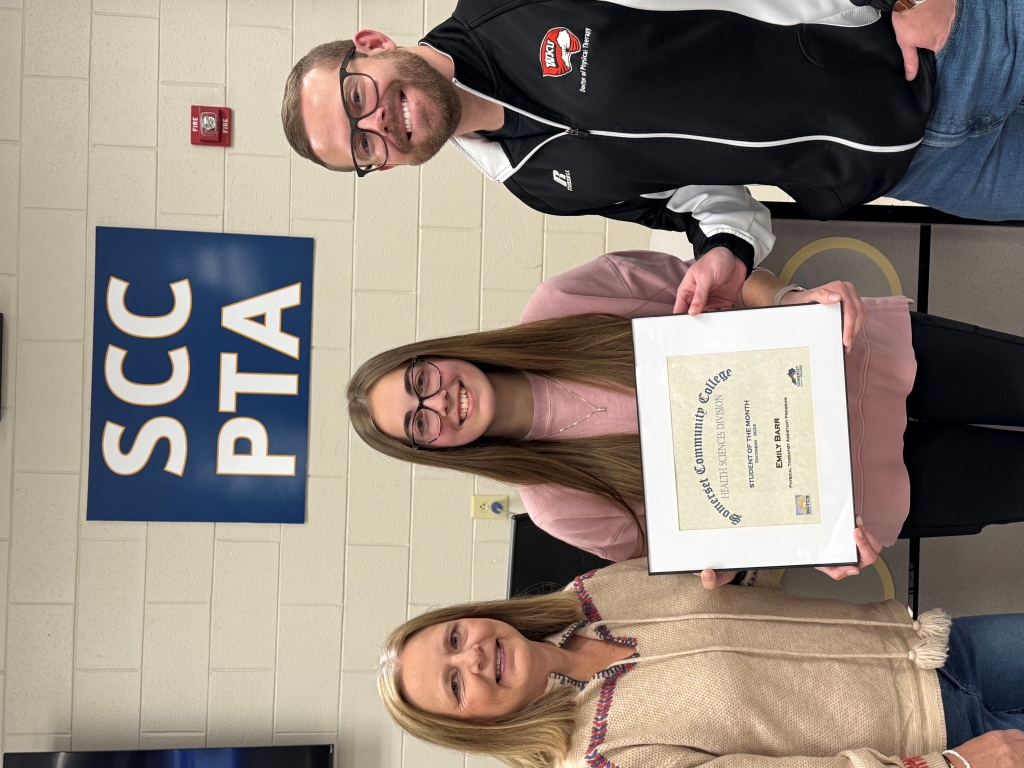 from left to right: Dr. Melanie Hines, PTA Program Director of Clinical Education; Emily Barr with her Student of the Month certificate; DR. Corey Moore, PTA Program Director