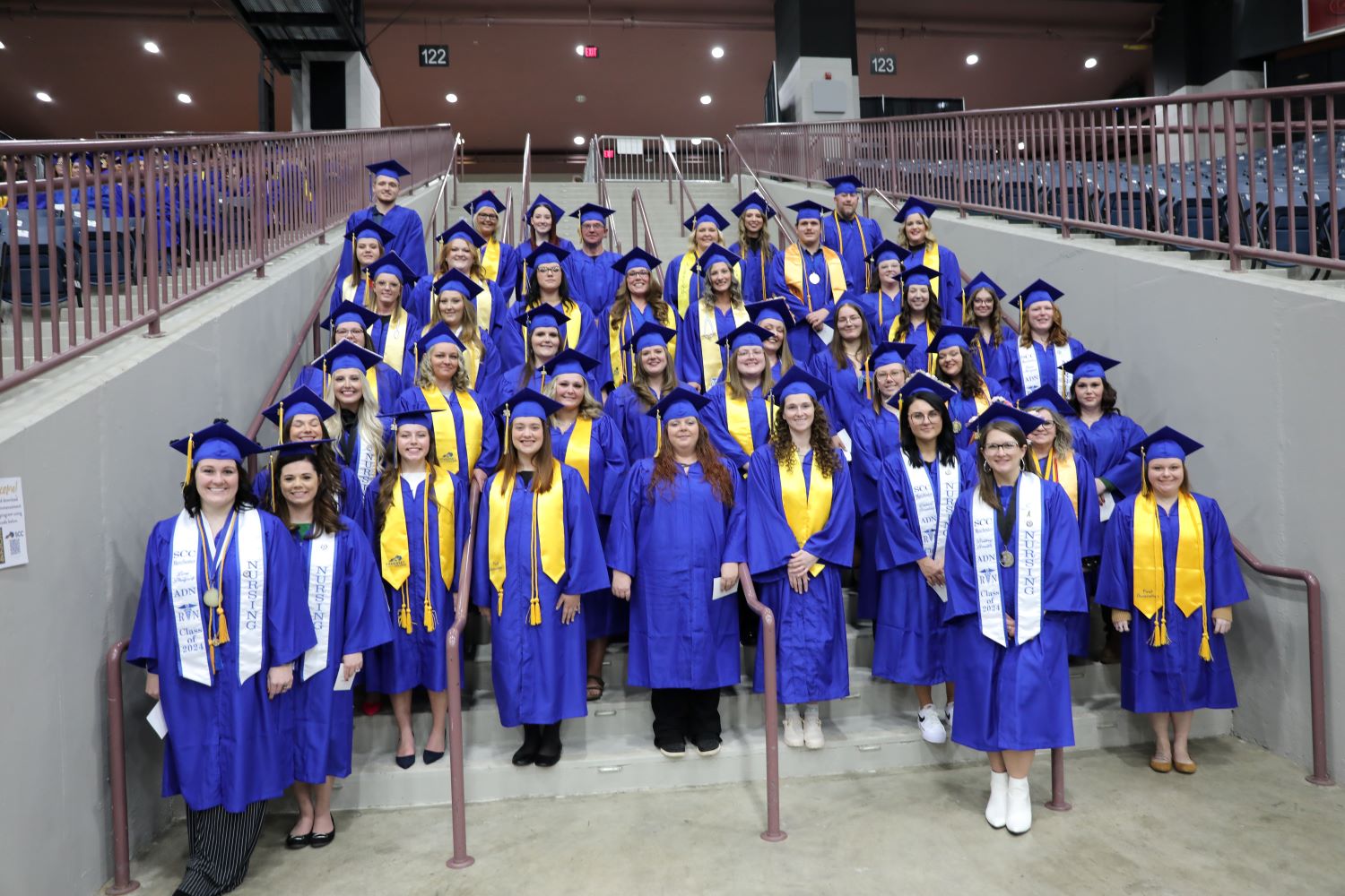 group of First Generation students wearing graduation regalia