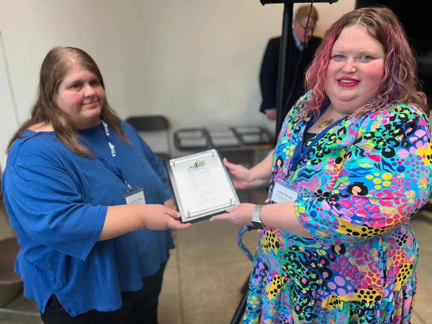 Julie Howe (right) of Somerset Community College is presented with the Outstanding Academic Librarian Award by Laura Hall (left), chair of KLA Member Services Committee.