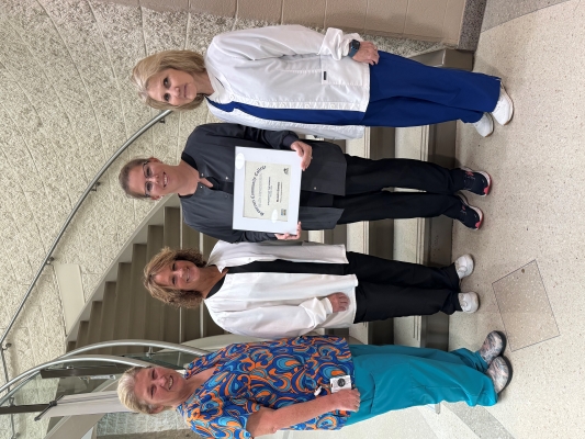 From left to right: Sherry Shepherd, Medical Assisting Laboratory Assistant; Tina Meier, Director of Clinical Education; Mandy Bargo; and Debra Elam, Program Director.