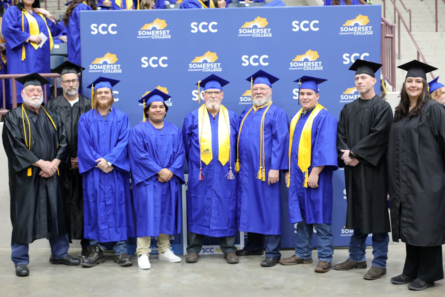 Welding and Auto group at graduation (names within the article)