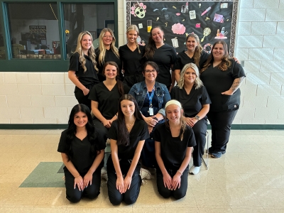 Humble, located in the middle, with her SCC cosmetology students.