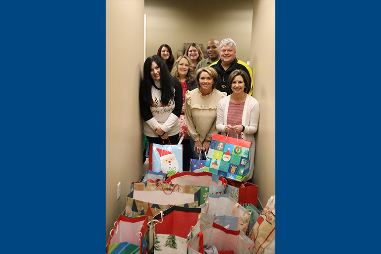The Circle of Love Angel Tree Project was a huge success this year. Pictured left to right: Back row: Natalie Winstead, Danna Jasper (representing Skills Program students), and George Martinez. Middle row: Sandy Bourne and Jeff Brickley. Front Row: Tina Watson, Angie Broyles, and Dana Muse.  Not pictured: Pam Bridgman and Deana Caron.