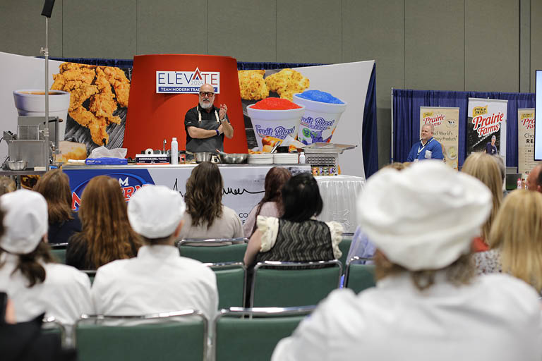 celebrity cehf andrew zimmern hosting a demostration during modern roadshow