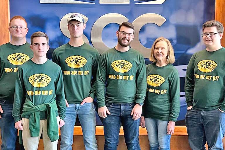 Shown celebrating Pi Week during March were, from left, Jonathan King, Eli Adkisson, Aaron Cook, Samuel Moore, instructor Kathy Lewis, Wesley Reynolds.  Shirt design by Samuel Moore.