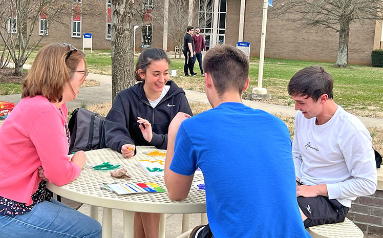 Game night for math and science students outside in meece courtyard