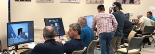 Community College faculty are instructed on how to create 3D models for their VR modules from Low-cost VR project staff. Participants using desktop computers.